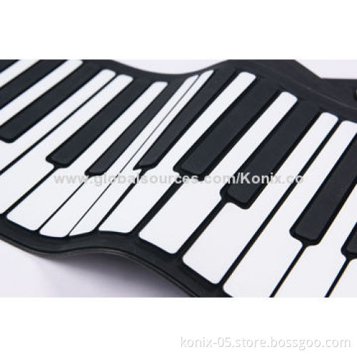 Some one play a folding roll up piano for learning